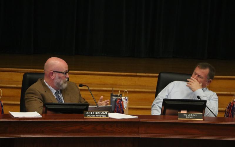 County Attorney Joel Foreman (left) stressed the importance of threats of penalties for people not obtaining necessary special use permits. (MORGAN MCMULLEN/Lake City Reporter)