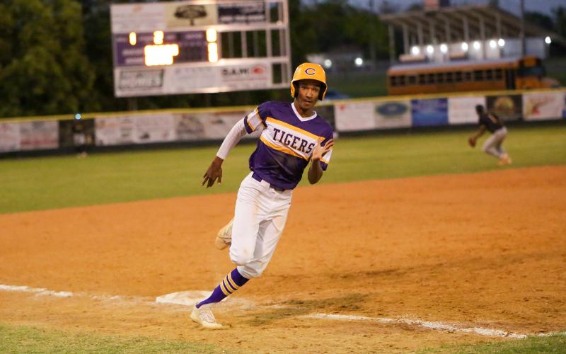 Columbia shortstop Brayden Thomas turns off third base on his way to home plate to score a run against Valdosta on Thursday night. (BRENT KUYKENDALL/Lake City Reporter)