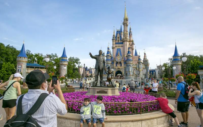 People visit the Magic Kingdom Park at Walt Disney World Resort in Lake Buena Vista on April 18, 2022. (TED SHAFFREY/AP File)