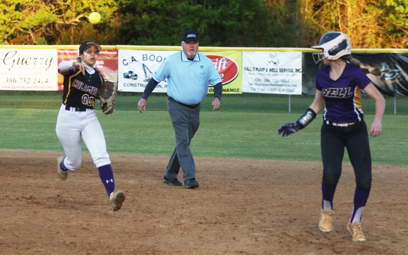 Columbia’s Luisa Taylor chases after Bell’s Dacy Graham in a rundown during Wednesday night’s game. (MORGAN MCMULLEN/Lake City Reporter)