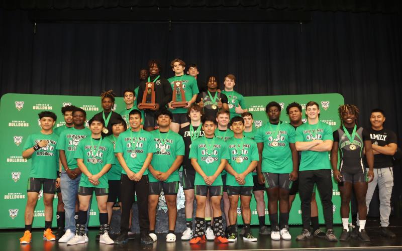 Suwannee’s weightlifting team poses with its two trophies after sweeping the District 5-1A titles on Friday. (PAUL BUCHANAN/Special to the Reporter)