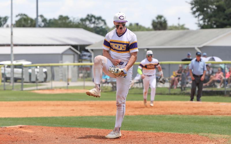 Columbia pitcher Hayden Gustavson celebrates after working out of an inning against Lincoln on Saturday in the Region 1-5A semifinals. (BRENT KUYKENDALL/Lake City Reporter)
