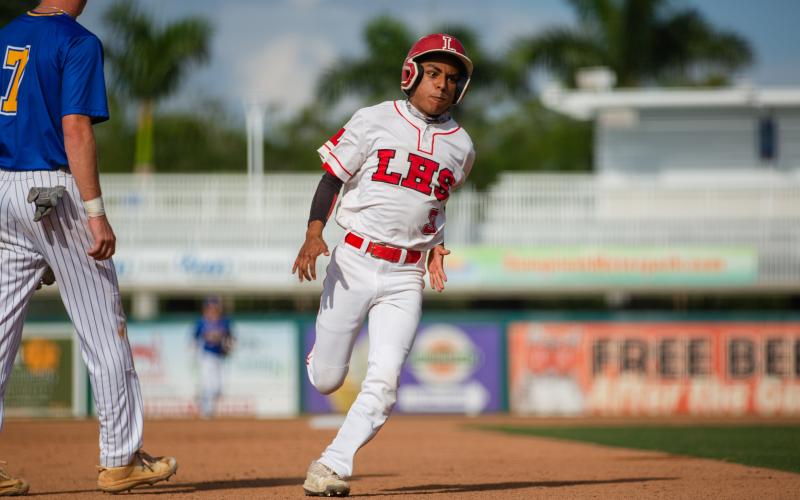 Lafayette outfielder Kevin Posada runs to third base against Chipley in the Class 1A state championship Thursday at Hammond Stadium in Fort Myers. (JESSICA PINALD/Special to the Reporter)