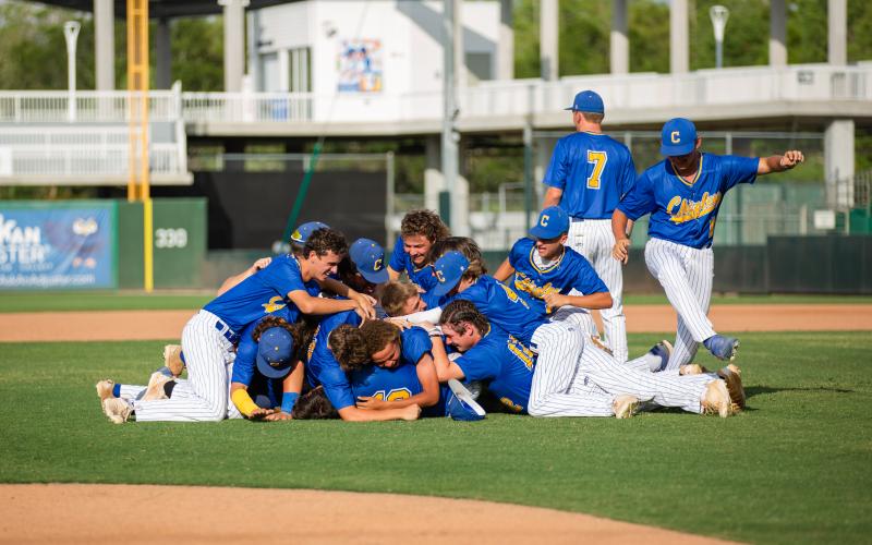 Chipley's baseball team dogpiles in celebration after defeating Lafayette to win the Class 1A state title on Thursday at Hammond Stadium in Fort Myers. (JESSICA PINALD/Special to the Reporter)