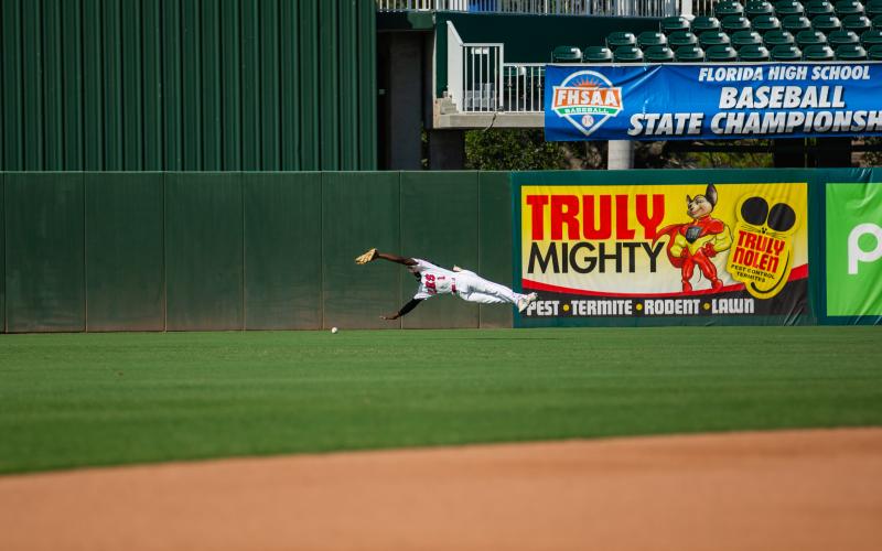 Lafayette centerfielder dives but misses a catch against Chipley in the Class 1A state championship Thursday at Hammond Stadium in Fort Myers. (JESSICA PINALD/Special to the Reporter)