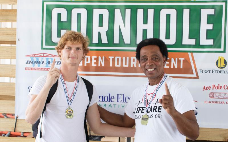 Ricky Nicky, the team of Lake City’s Nick Wilkerson (left) and Ricky Jernigan, won the competitive division at the Suwannee Valley Cornhole Tournament. (COURTESY)