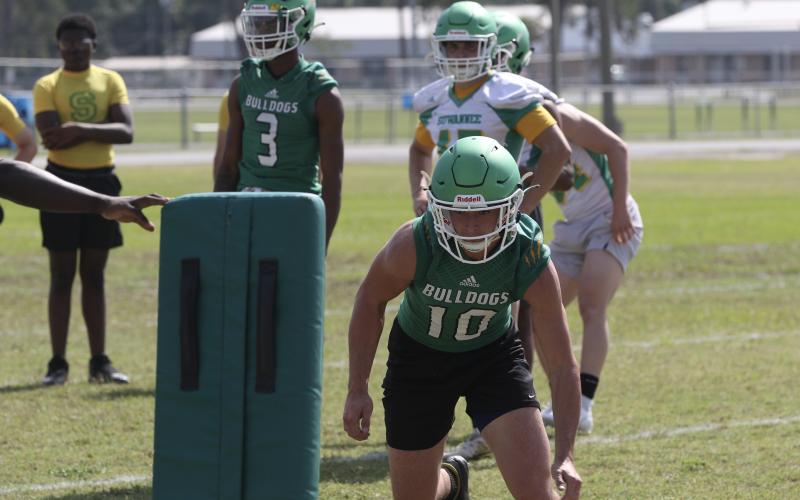 Suwannee quarterback/safety Kodi Lang performs a drill during Monday’s practice. (JAMIE WACHTER/Lake City Reporter)