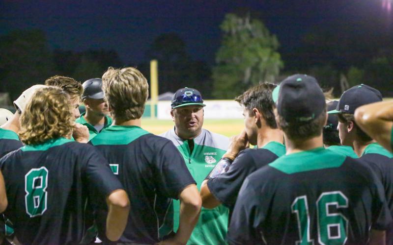 Suwannee head coach Justin Bruce speaks to his team during the Region 1-4A quarterfinals against Baker County on May 11, 2022. (BRENT KUYKENDALL/Lake City Reporter)