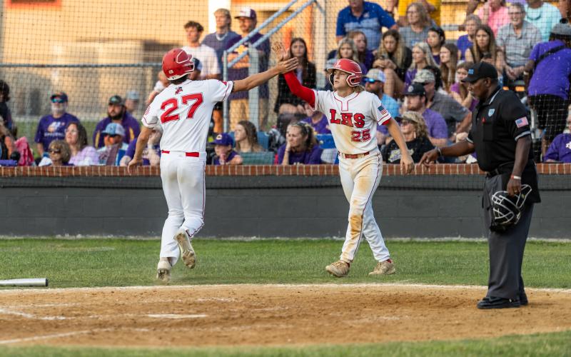 Lafayette's Matthew Jenkins (27) and Dawson Mock (25) celebrate Jenkins' two-run home run against Union County during Saturday's Region 3-1A final. (JACK HOWDESHELL/Special to the Reporter)