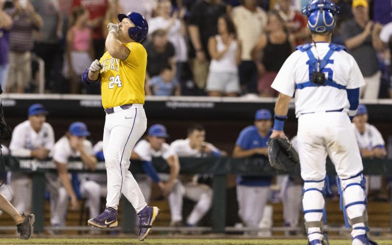 LSU's Cade Veloso celebrates as he approaches home plate after hitting a solo home run to take the lead against Florida in the 11th inning of Game 1 of the College World Series finals on Saturday in Omaha, Neb. (REBECCA S. GRATZ/Associated Press)