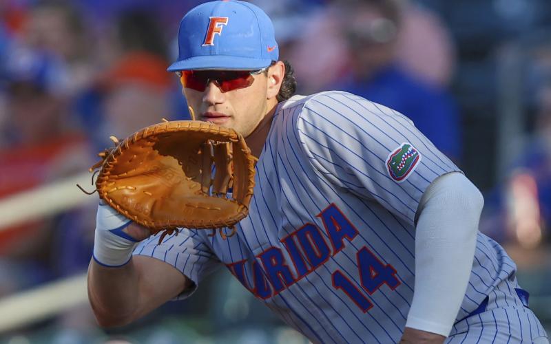 Florida's Jac Caglianone (14) waits for a throw to first during a game against Florida State on May 2 in Jacksonville. (GARY MCCULLOUGH/AP File)
