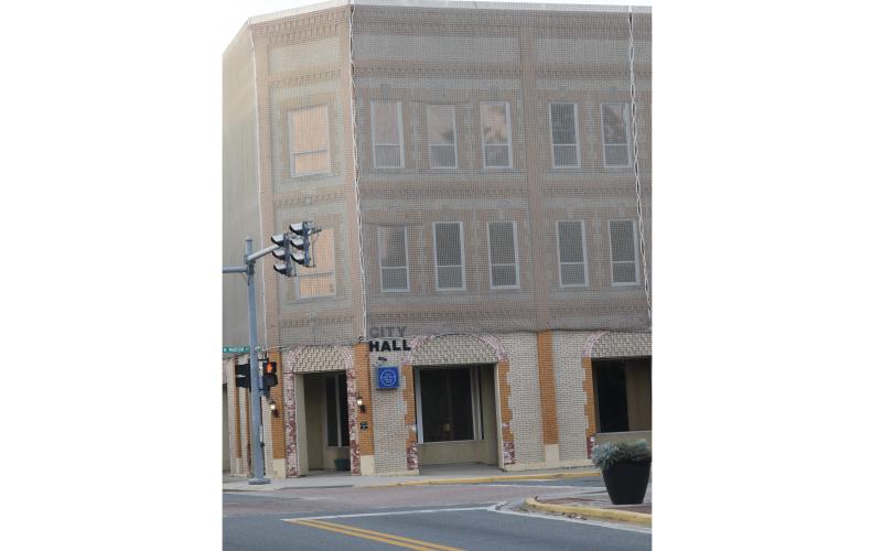 The Lake City Council will discuss the future of Lake City Hall at a workshop today. The current city hall has a safety net attached to it to prevent bricks from falling. (FILE)