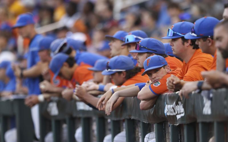 The Florida dugout watches in the seventh inning of Game 3 of the College World Series against LSU on Monday in Omaha, Neb.. (REBECCA S. GRATZ/Associated Press)