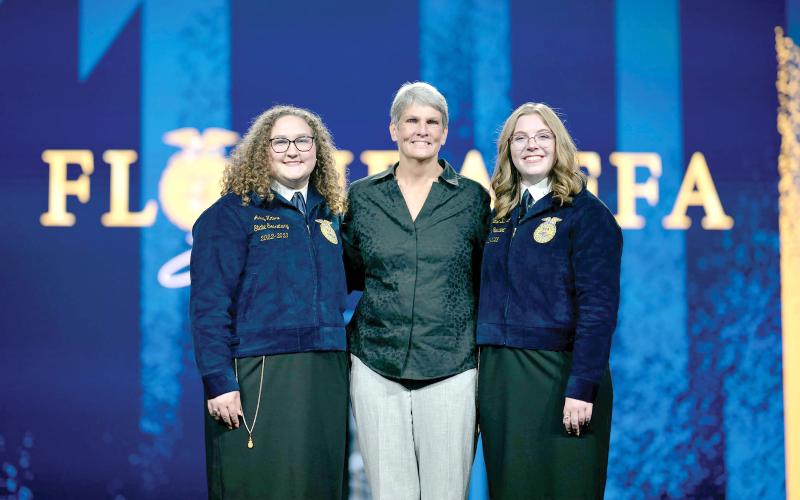 Former Fort White FFA advisor Jill Huesman (middle) was inducted into the Florida FFA Hall of Fame this week at the state convention. Huesman is pictured with FFA State President and Fort White High graduate Anelise Bullard (right) and FFA State Secretary Abby Kruse during the induction Tuesday. (COURTESY)