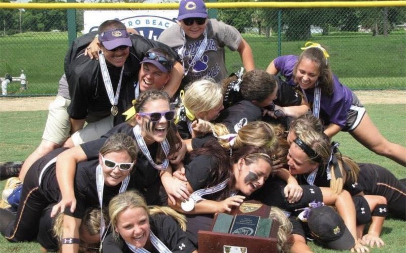 Columbia’s 2013 softball team celebrates in a dogpile after defeating Pembroke Pines Charter to win the Class 6A state championship on May 12, 2013, at the Vero Beach Sports Village. (FILE)