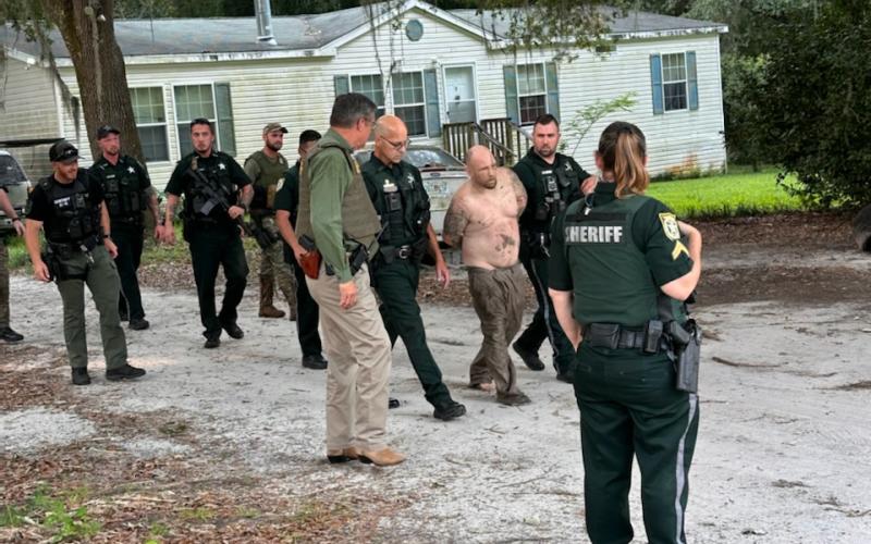 David Cooper was apprehended Monday by the Columbia County Sheriff’s Office following a four-hour manhunt in which he fled from authorities and hid in a wooded area. (COURTESY)