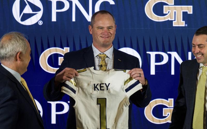 Newly hired Georgia Tech football coach Brent Key holds up a jersey during a news conference on Dec. 5, 2022, in Atlanta. (AP FILE)
