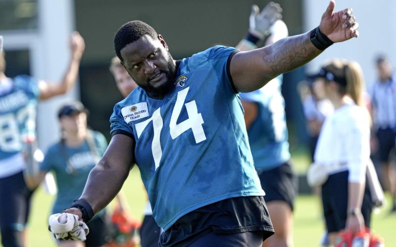 Jacksonville Jaguars offensive tackle Cam Robinson (74) warms up during Thursday's practice in Jacksonville. (JOHN RAOUX/Associated Press)