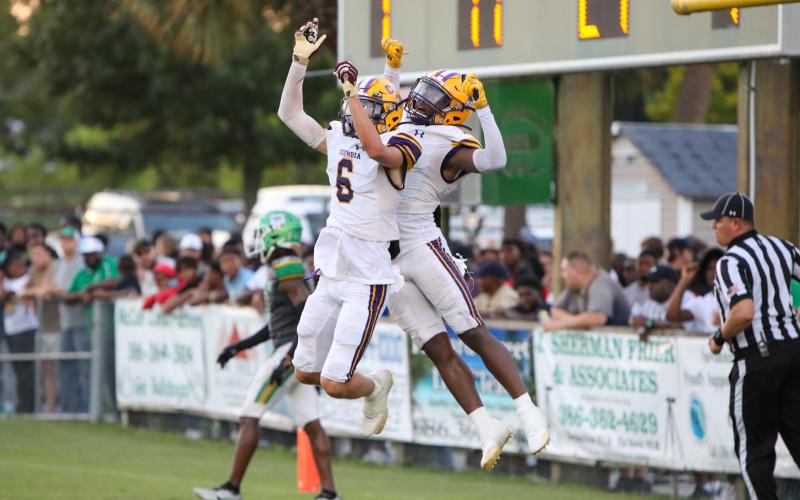 Columbia receivers Bynton Edge (left) and Zamarion Jones (right) celebrates after Jones caught a touchdown pass against Suwannee in last Friday’s Preseason Classic. (BRENT KUYKENDALL/Lake City Reporter)