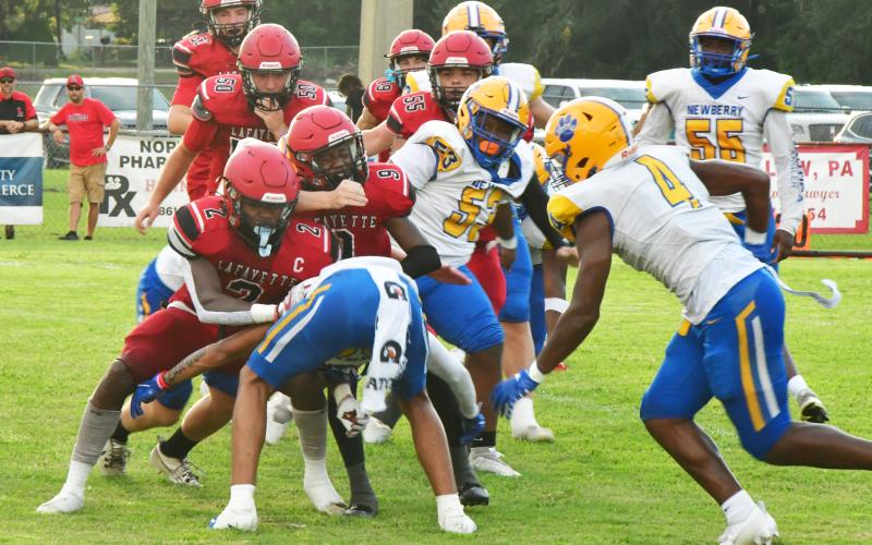 Lafayette quarterback Tywan Williamson is tackles by a host of Newberry defenders during last Friday's Preseason Classic. (ROB WOLFE/Special to the Reporter)