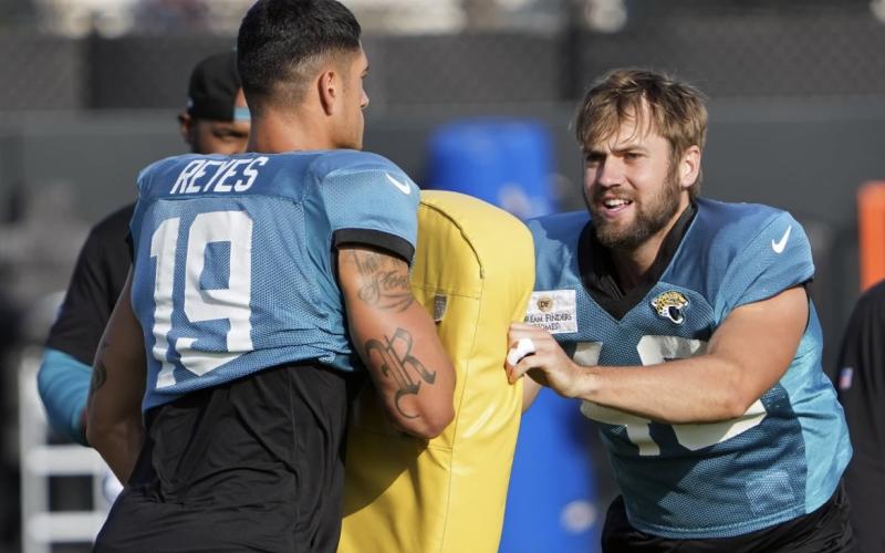 Jacksonville Jaguars tight end Josh Pederson (right) runs through a drill with tight end Samuel Reyes (19) during a practice on Tuesday in Jacksonville. (JOHN RAOUX/Associated Press)