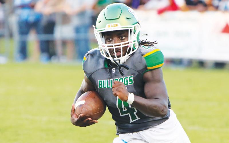 Suwannee running back Marquavious Owens rushes up the field against Columbia during Friday’s Preseason Classic. (BRENT KUYKENDALL/Lake City Reporter)