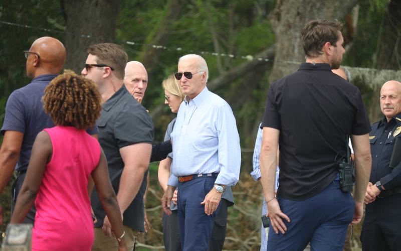 Live Oak Mayor Frank Davis talks with President Joe Biden outside the Douglass Center on Saturday during Biden's visit to see storm damage in the city following Hurricane Idalia. (JAMIE WACHTER/Lake City Reporter)