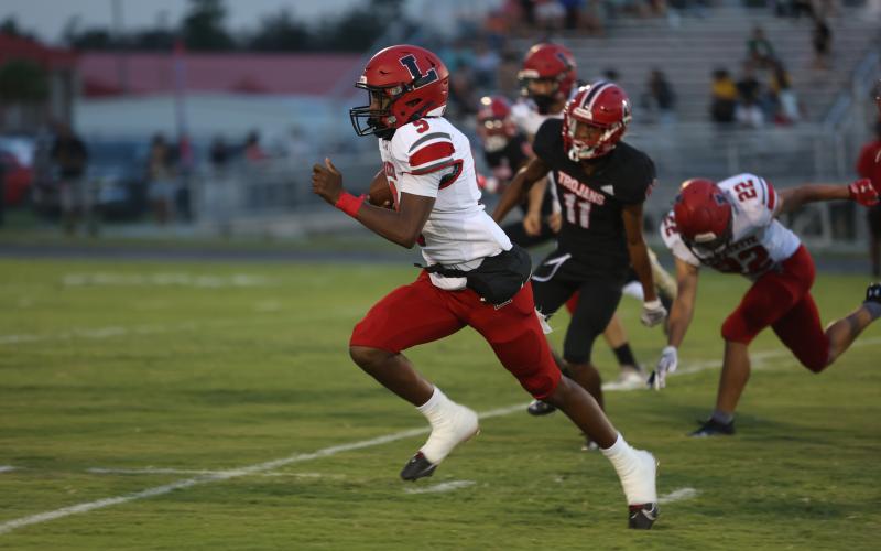 Lafayette quarterback Tywan Williamson races upfield during Friday’s 53-6 win over Hamilton County. (PAUL BUCHANAN/Special to the Reporter)