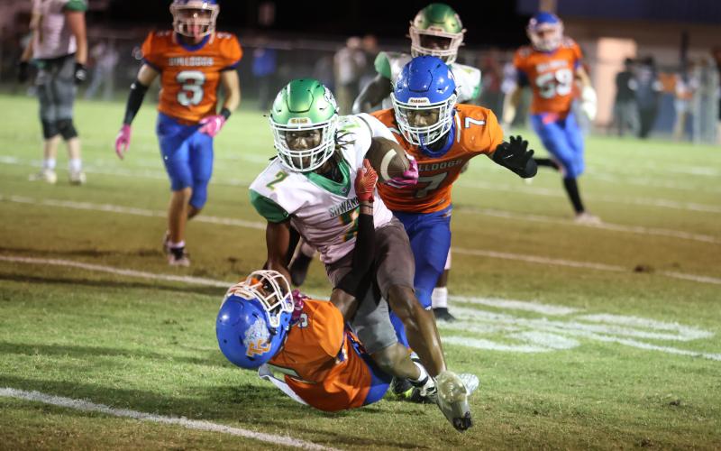 Suwannee receiver Amarion Rojas runs over a Taylor County on Friday night. (PAUL BUCHANAN/Lake City Reporter)