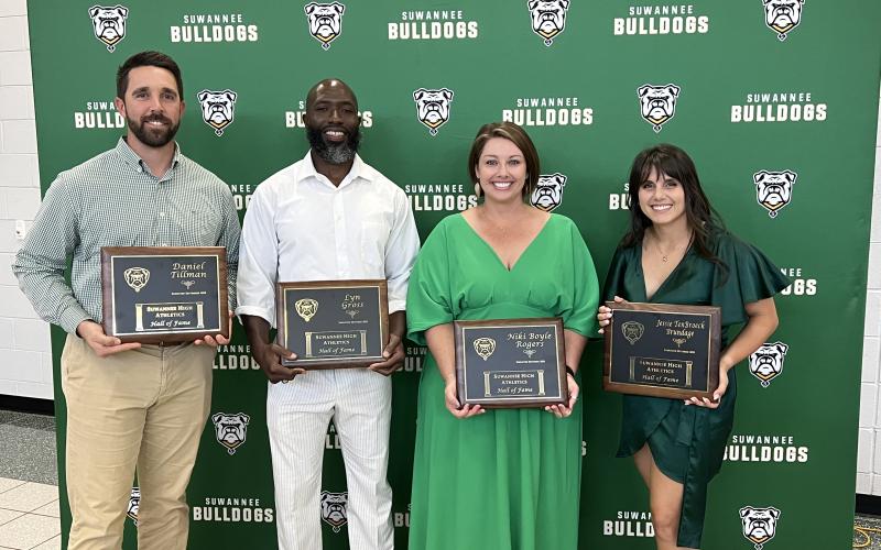 Daniel Tillman (left), a 2022 Suwannee High School Athletics Hall of Fame inductee, joined Class of 2023 inductees Lyn Gross, Niki Boyle Rogers and Jessie TenBroeck Brundage in being honored Thursday during the induction ceremony. Leon Moses, the fourth member of the 2023 class, could not attend. (JAMIE WACHTER/Lake City Reporter)