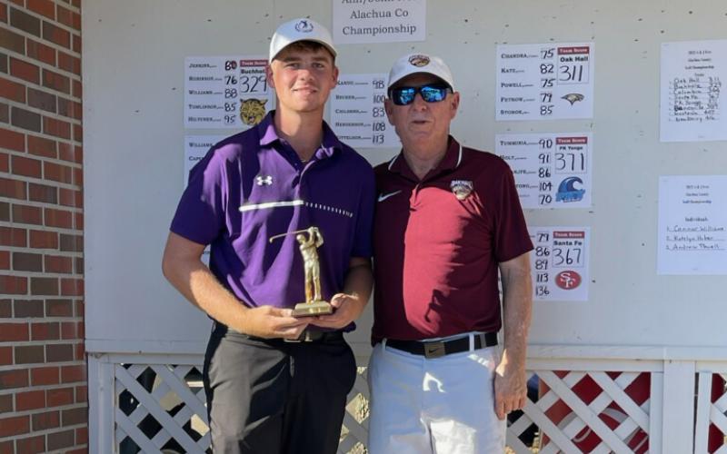 Columbia golfer Connor Williams (left) is above with tournament host Frank Anderson after winning the Ann/John Ives Alachua County Championship on Wednesday.