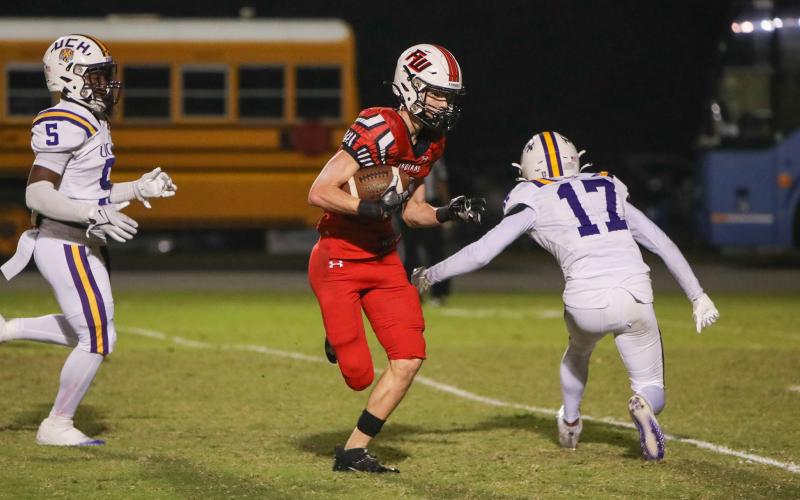 Fort White receiver Garrett Brady makes a Union County defender miss on his way to the end zone for a touchdown during Friday’s Region 3-1R semifinal. (BRENT KUYKENDALL/Lake City Reporter)