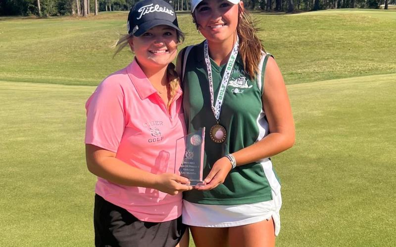 Suwannee High’s Ryan Donaldson (right), pictured with Columbia High’s Karlee Gainey at the district tournament, was added to the Class 2A state qualifiers list Friday after mistakenly being left off Thursday. (COURTESY)