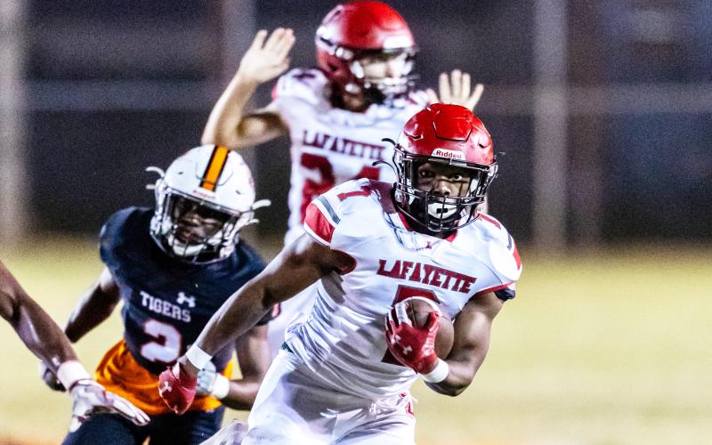 Lafayette’s Ja’marien Ervin returns an interception for a touchdown against Trenton on Oct. 20. (JACK HOWDESHELL/Special to the Reporter)