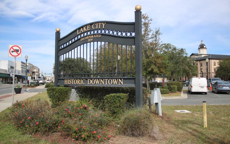 One of the City of Lake City’s historic downtown gate signs sits at Duval Street at the intersection with Marion Avenue. The sign on the north end of the historic downtown district was taken down this week to be moved further north. (TONY BRITT/Lake City Reporter)