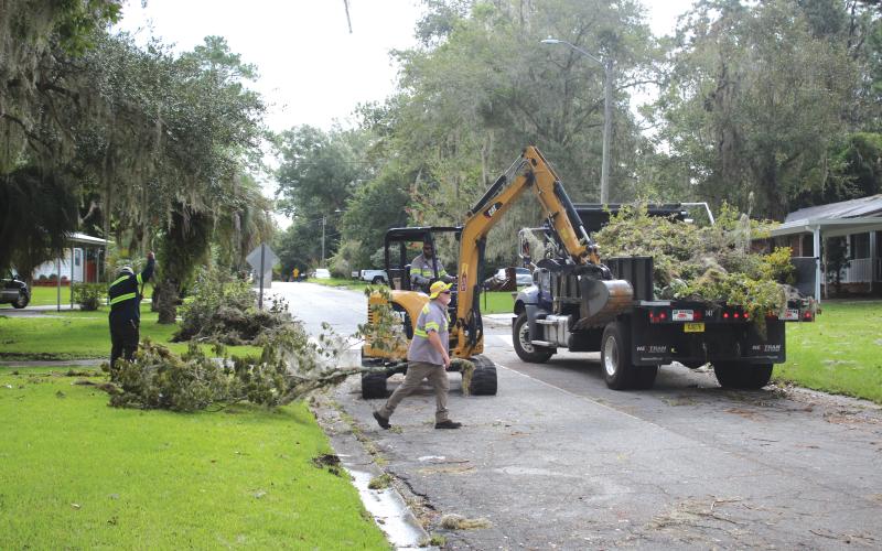 City of Lake City Public Works employees clear a road of debris following Hurricane Idalia’s landfall in late August. The hurricane impacted multiple counties in North Florida, including Lafayette and Suwannee. (TONY BRITT/Lake City Reporter)