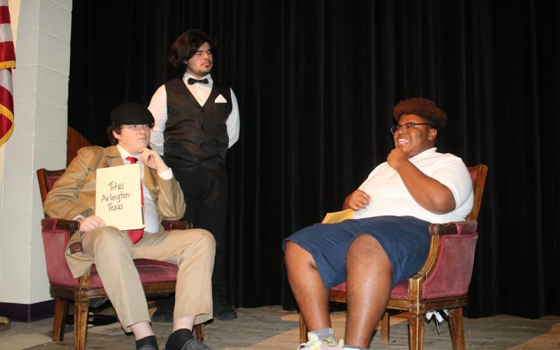 Nickolas Stewart (from left), Gian Rivera, portraying a detective and butler, question Schmari Lockley  during dress rehearsal for The Alibis, a Columbia High School theater production that will take place this weekend. (TONY BRITT/Lake City Reporter)