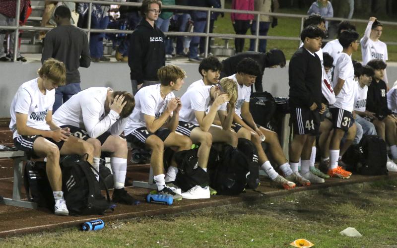 Suwannee’s bench sits disappointed after dropping a 3-1 decision in Tuesday’s District 2-4A championship match. (MORGAN MCMULLEN/Lake City Reporter)