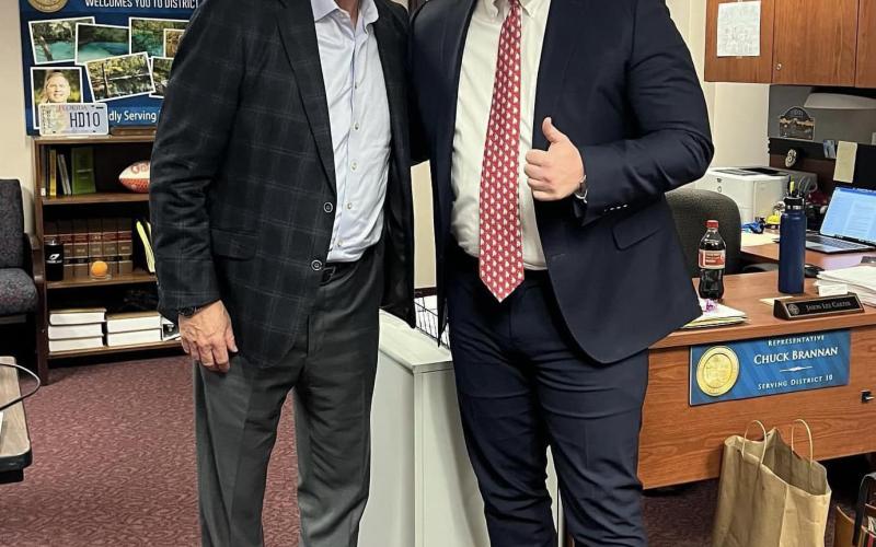 Jason Carter, Rep. Chuck Brannan’s legislative aide, gets a picture with Tom Glavine during the Hall of Fame pitcher’s stop at the Capitol. (COURTESY)