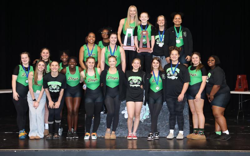 Suwannee's girls weightlifting team celebrates after winning the Region 1-1A titles in traditional and Olympic on Saturday. (PAUL BUCHANAN/Special to the Reporter)