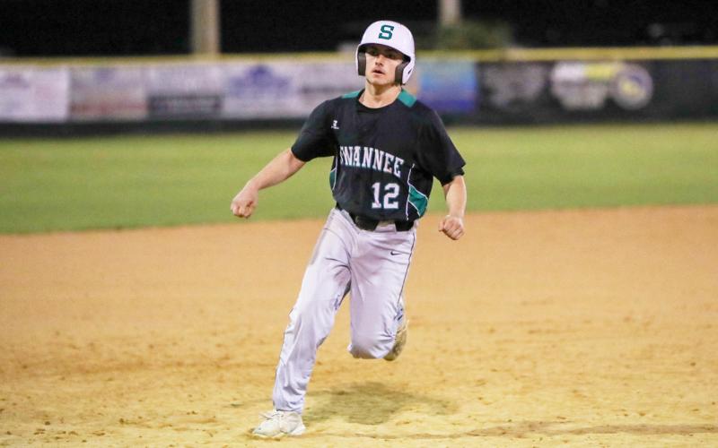 Suwannee's Caiden Jenkins strolls into third base during a game against Columbia on Feb. 29. (BRENT KUYKENDALL/Lake City Reporter)