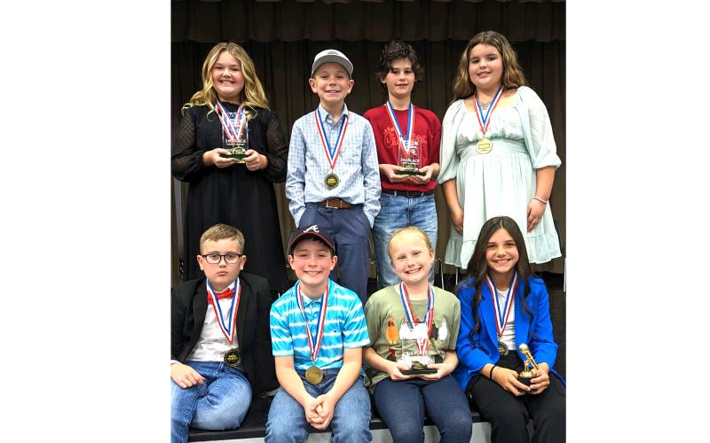 The eight finalists competing in the county speaking contest were, in back, Bristol Land (from left), Cooper Kirby, Miles Jackson and Sadie Byrd; in front, Trevor Mosley, Tatum Hart, Parker Gaskins and Reese Walker. (COURTESY)