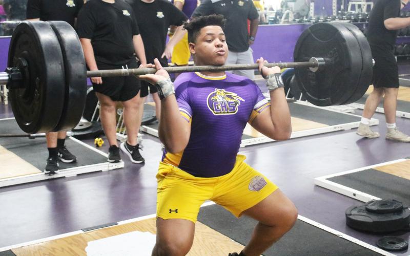 Columbia lifter Javon Bradley performs the clean and jerk during a tri-meet against Buchholz and Hamilton County on Feb. 28. (JORDAN KROEGER/Lake City Reporter)