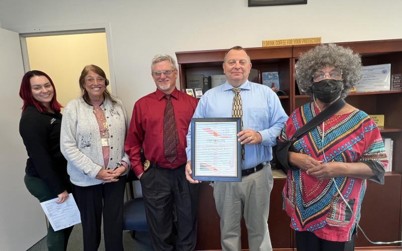 LCPD Community Relations Coordinator Ashley Hardison (from left), Sue Tuell, Assistant Police Chief Andy Miles, Chief Gerald Butler and Bernice D. Presley pose after Butler was presented with a Certificate of Appreciation. (COURTESY)