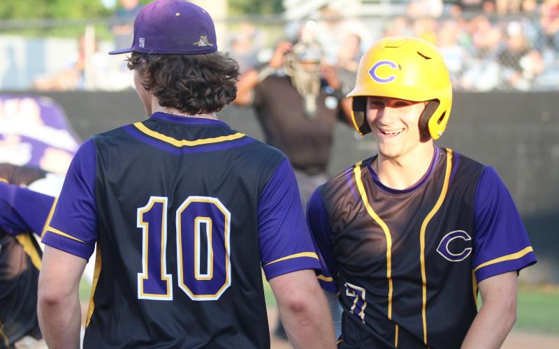 Columbia outfielder Bynton Edge (right) celebrates with Ayden Phillips after scoring a run against Chiles on April 17. The Tigers defeated IMG Academy 1-0 on Friday in extra innings after Edge hit a go-ahead RBI single in the eighth inning. (JORDAN KROEGER/Lake City Reporter)