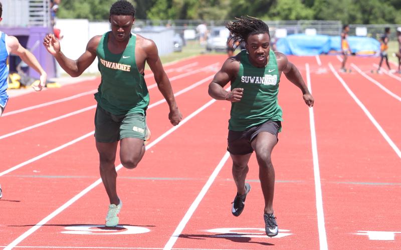 Suwannee runner Marquavious Owens won the 100m just ahead of teammate Michael Rossin at the Columbia High Jungle Open on Saturday. (PAUL BUCHANAN/Special to the Reporter)