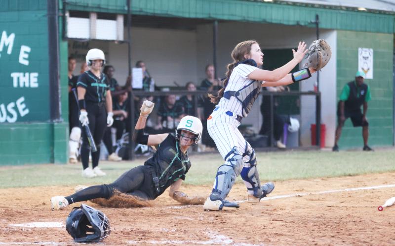 Suwannee’s Rachel Smith slides safely into home plate to score a run against Taylor County during Tuesday’s District 2-3A semifinal. (PAUL BUCHANAN/Special to the Reporter)